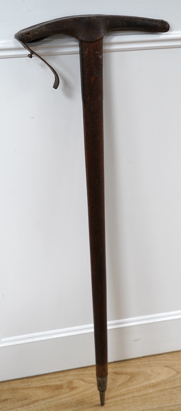 An Edward Hill & Son early 20th century Alpine mountaineer’s axe with original stamped leather cover, 99cm long. Condition - fair to good